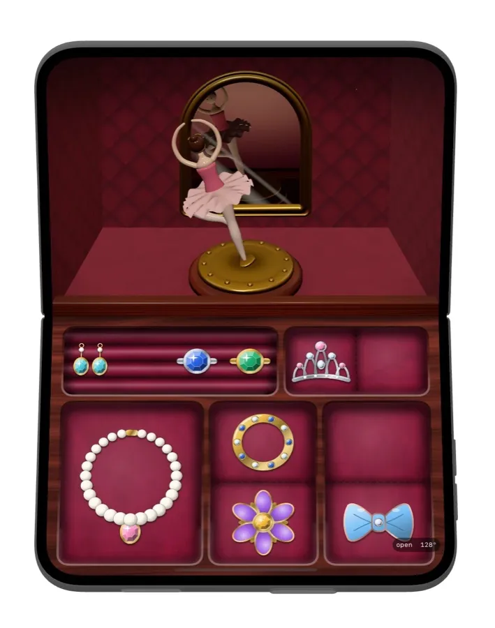 The first ballerina spinning in front of the mirror, above the jewellery tray